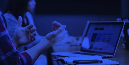 Academy image with someone working on a laptop