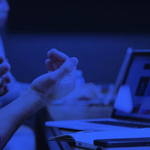 Academy image with someone working on a laptop